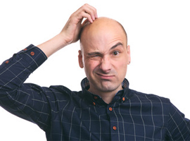 Bald man scratching his head